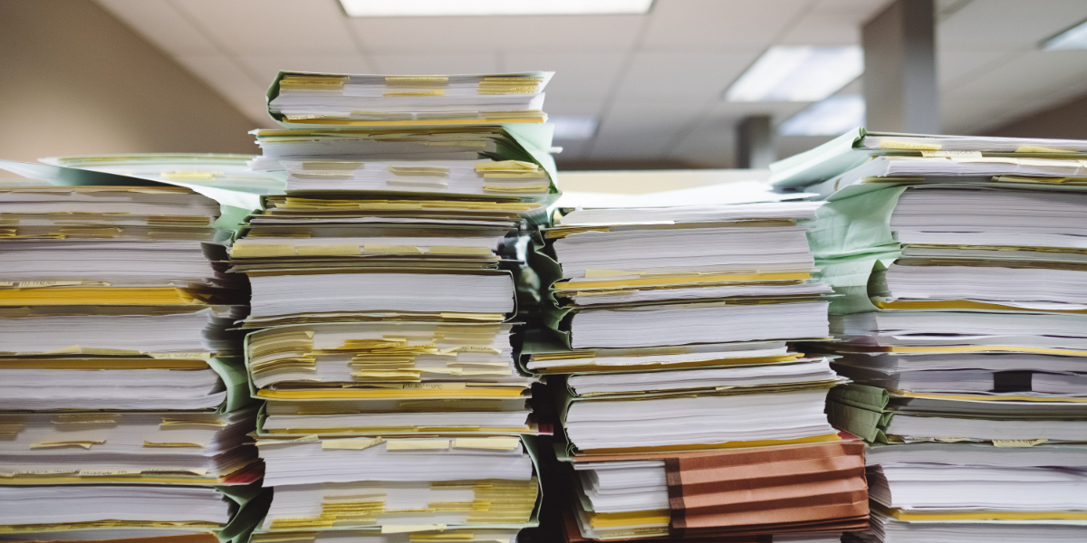 A stack of medical technology documentation